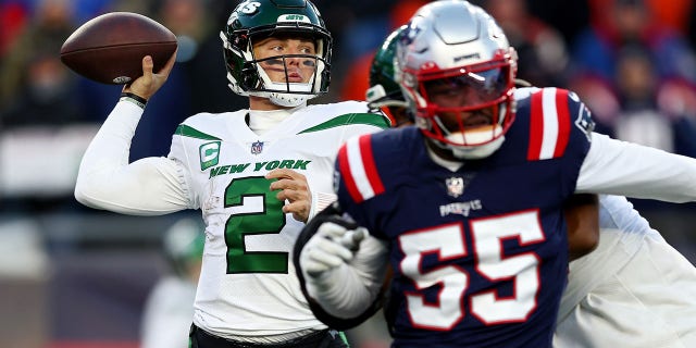 Zach Wilson #2 of the New York Jets throws a pass against the New England Patriots during the second half at Gillette Stadium on November 20, 2022 in Foxborough, Massachusetts. 