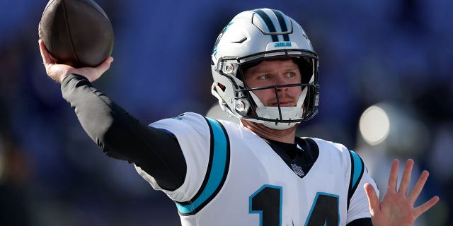 Carolina Panthers quarterback Sam Darnold, #14, warms up against the Baltimore Ravens at M&T Bank Stadium on Nov. 20, 2022 in Baltimore.