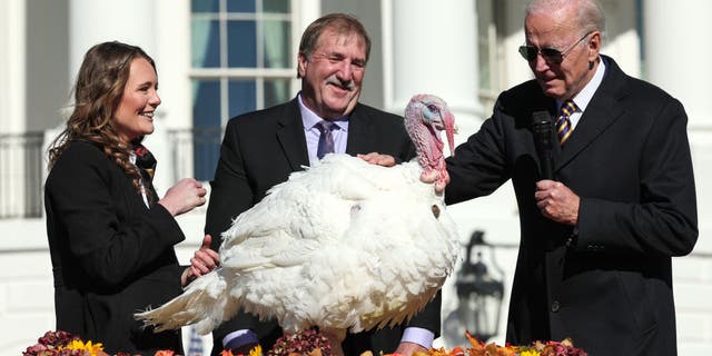 President Biden pardons Chocolate, the National Thanksgiving Turkey, as he is joined by the 2022 National Turkey Federation Chairman Ronnie Parker and Alexa Starnes, daughter of the owner of Circle S Ranch, on the South Lawn of the White House Nov. 21, 2022, in Washington, D.C.