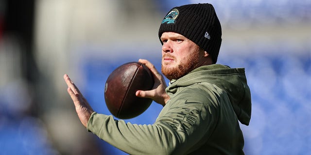 Sam Darnold, number 14 of the Carolina Panthers, throws before the game against the Baltimore Ravens at M&T Bank Stadium on November 20, 2022 in Baltimore.