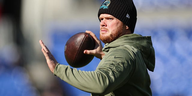 Sam Darnold, number 14 of the Carolina Panthers, throws before the game against the Baltimore Ravens at M&T Bank Stadium on November 20, 2022 in Baltimore.