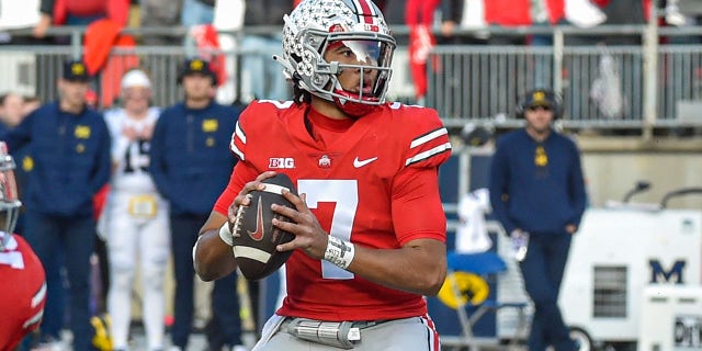 C.J. Stroud of the Ohio State Buckeyes looks to throw a pass against the Michigan Wolverines at Ohio Stadium on November 26, 2022, in Columbus, Ohio.