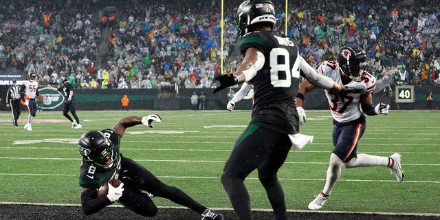 Jets' Elijah Moore scores a touchdown in the third quarter against the Bears on Nov. 27, 2022, in East Rutherford, New Jersey.