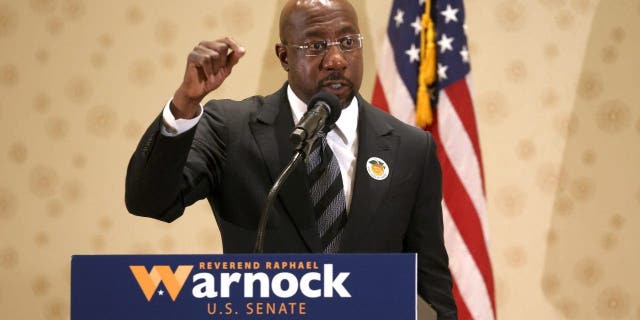 Georgia Democratic senate candidate U.S. Sen. Raphael Warnock (D-GA) speaks during a campaign rally on November 27, 2022 in Morrow, Georgia.