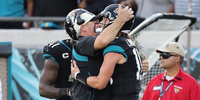 Trevor Lawrence #16 of the Jacksonville Jaguars celebrates with head coach Doug Pederson during the second half of the game against the Baltimore Ravens at TIAA Bank Field on November 27, 2022 in Jacksonville, Florida. 