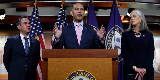 Rep. Hakeem Jeffries (D-NY) (C) talks to reporters with Rep. Pete Aguilar (D-CA) (L) and Rep. Katherine Clark (D-MA) after they were elected to House Democratic leadership for the 118th Congress at the U.S. Capitol Visitors Center on November 30, 2022, in Washington, DC.