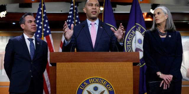 Rep. Hakeem Jeffries (D-NY) (C) talks to reporters with Rep. Pete Aguilar (D-CA) (L) and Rep. Katherine Clark (D-MA) after they were elected to House Democratic leadership for the 118th Congress at the U.S. Capitol Visitors Center on November 30, 2022, in Washington, DC.