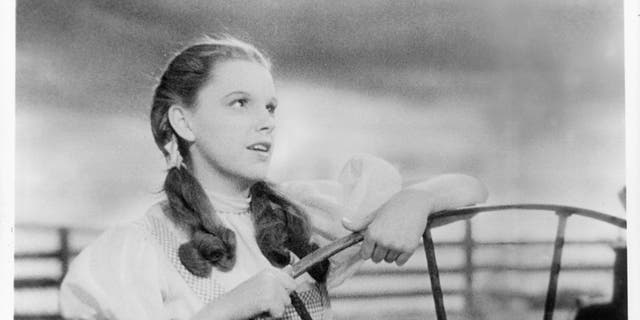 Judy Garland performing "Over the Rainbow," which won an Oscar for best original song and is considered by many critics to be the greatest song in American history.