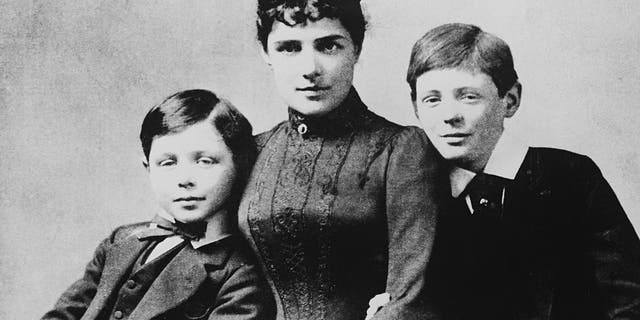 At far right, a young Winston Churchill (1874-1965), the future British prime minister, pictured with his mother — American heiress Lady Jennie Jerome — and his younger brother John Strange Spencer-Churchill.