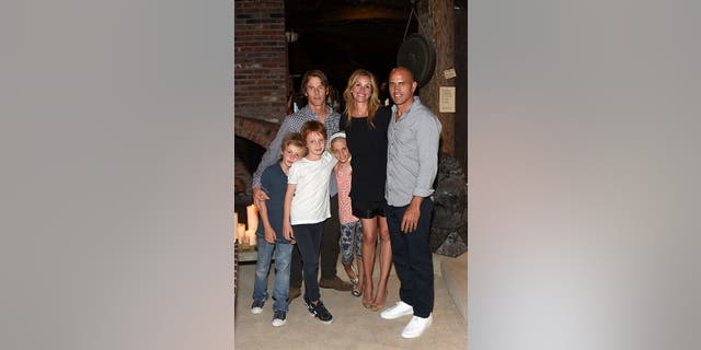 Roberts shares Finn and Hazel with her husband Danny Moder, 53. The couple, married for 20 years, also are parents to 15-year-old son Henry. They are pictured here with Kelly Slater in 2012.