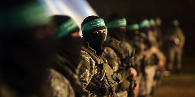 Palestinian members of the Ezzedine al-Qassam Brigades, the armed wing of the Hamas movement, take part in a rally January 31, 2016 in Gaza City to pay tribute to fellow militants who died after a tunnel collapse in the Gaza Strip. 