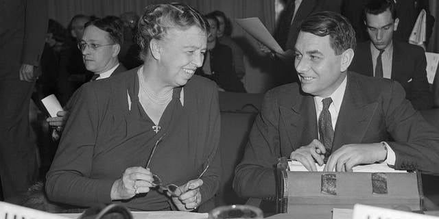 Eleanor Roosevelt, member of the U.S. delegation to the U.N., chats with Mr. E. Davies, M.P. and member of the British delegation, during the meeting of the Social, Cultural and Humanitarian Committee of the U.N. In an address before the 57-nation committee, Mrs. Roosevelt accused the Soviet states of "poisoning the wells of international friendship" with a flood of propaganda against the U.S.
