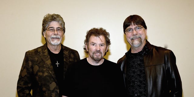 (L-R) Alabama's Randy Owen, Jeff Cook and Teddy Gentry backstage at the Country Music Hall of Fame in 2016.
