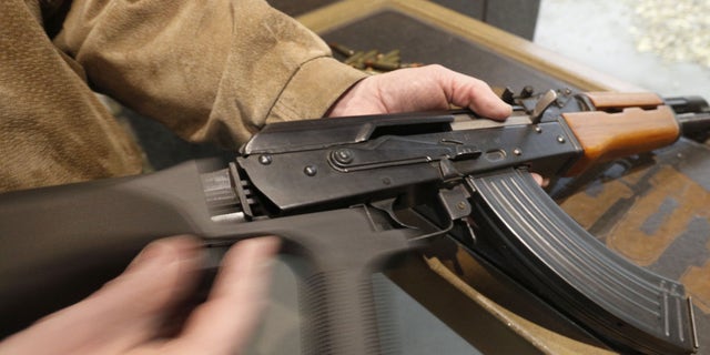 A bump stock is installed on an AK-47 and its movement is demonstrated at Good Guys Gun and Range on February 21, 2018, in Orem, Utah. 