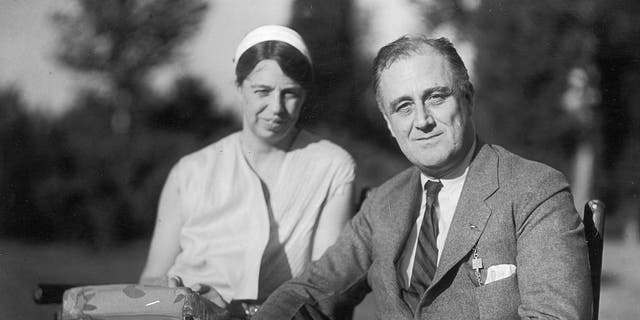 Portrait of President Franklin D. Roosevelt and wife Eleanor Roosevelt seated outside in the garden, circa 1930s. The fifth cousins married in 1905 and resided in the White House from 1933 to 1945. 