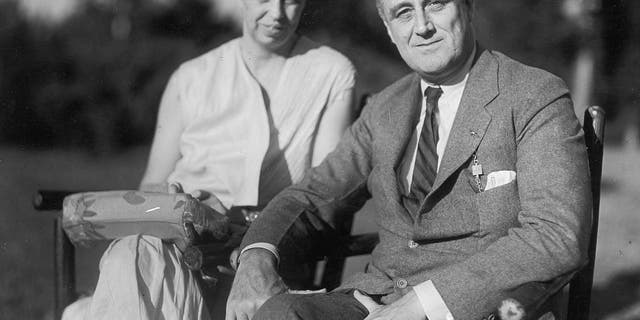 Portrait of President Franklin D. Roosevelt and wife Eleanor Roosevelt seated outside in the garden, circa 1930s. The fifth cousins married in 1905 and resided in the White House from 1933 to 1945.