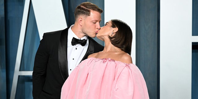 Christian McCaffrey and Olivia Culpo attend the 2022 Vanity Fair Oscar Party Hosted by Radhika Jones at Wallis Annenberg Center for the Performing Arts on March 27, 2022 in Beverly Hills, California. 