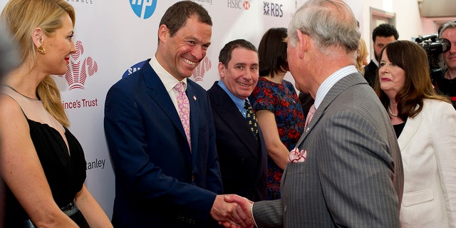 Dominic West meets then-Prince Charles at the Prince's Trust and Samsung Celebrate Success Awards on March 12, 2014, in London.