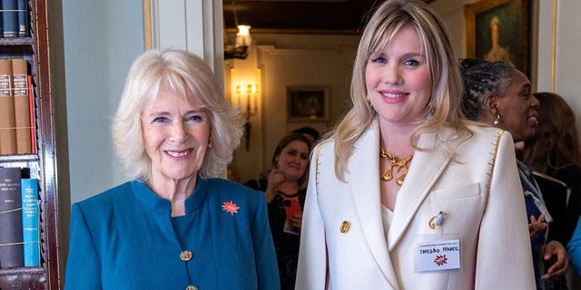 Queen Consort Camilla, left, met actress Emerald Fennell during a reception to mark International Women's Day at Clarence House in London on March 8, 2022.
