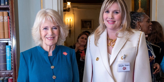 Queen Consort Camilla, left, met actress Emerald Fennell during a reception to mark International Women's Day at Clarence House in London on March 8, 2022.