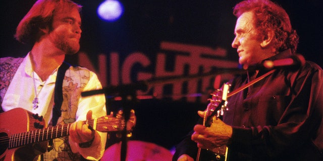 Johnny Cash performing on stage with his son John Carter Cash, left, at the Nighttown in Rotterdam, Netherlands on June 30, 1994.