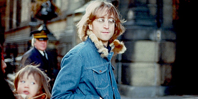 Former Beatle John Lennon poses for a photo with his wife Yoko Ono and son Sean Lennon in 1977 in New York City. Lennon was gunned down outside his apartment in 1980.