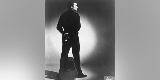 Country singer/songwriter Johnny Cash poses for a portrait in 1957 in Memphis, Tennessee.  His sister Joanne Cash said there was a special reason her brother so famously wore black.