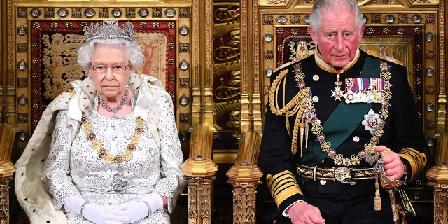 Queen Elizabeth II and Prince Charles, during the State Opening of Parliament at the Palace of Westminster on October 14, 2019, in London, England. The queen passed away on Sept. 8 at age 96.