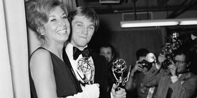 American actors Michael Learned, who played Olivia "Livie" Walton, and Richard Thomas, who played John "John Boy" Walton each hold their Emmy Awards for outstanding continued performance in a leading role, Hollywood, California, on May 20, 1973. 
