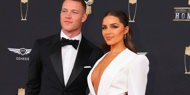 Carolina Panthers running back Christian McCaffrey  and Olivia Culpo pose on the Red Carpet poses prior to the NFL Honors on February 1, 2020 at the Adrienne Arsht Center in Miami, Florida.