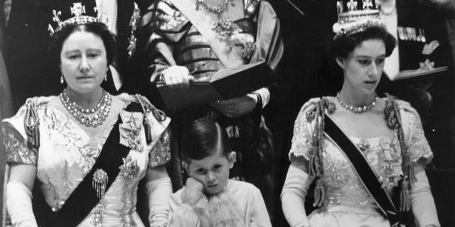 The Queen Mother (left) with her grandson Prince Charles (center) and his aunt Princess Margaret Rose (1930-2002) in the royal box at Westminster Abbey watching the coronation ceremony of Queen Elizabeth II.  