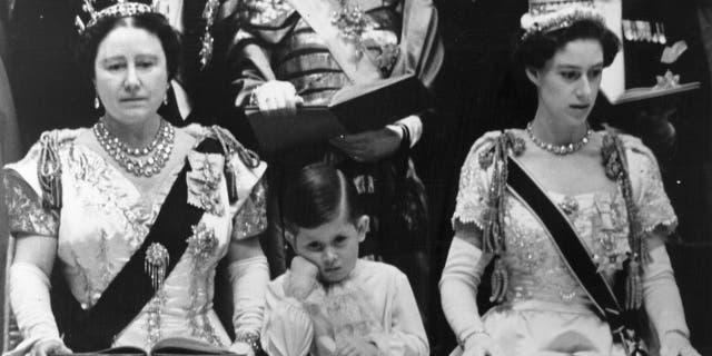 The Queen Mother (left) with her grandson Prince Charles (center) and his aunt Princess Margaret Rose (1930-2002) in the royal box at Westminster Abbey watching the coronation ceremony of Queen Elizabeth II.