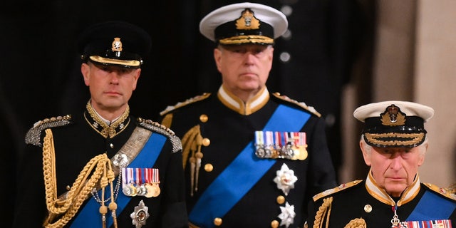 King Charles lll, right, Prince Andrew, Duke of York, center, and Prince Edward, Earl of Wessex, left, attend a vigil, following the death of Queen Elizabeth ll, inside Westminster Hall on Sept. 16, 2022 in London.