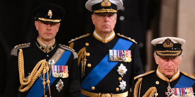 King Charles lll, right, Prince Andrew, Duke of York, center, and Prince Edward, Earl of Wessex, left, attend a vigil, following the death of Queen Elizabeth ll, inside Westminster Hall on Sept. 16, 2022 in London.