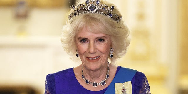Queen Consort Camilla wears Queen Elizabeth’s sapphire tiara at the state banquet.