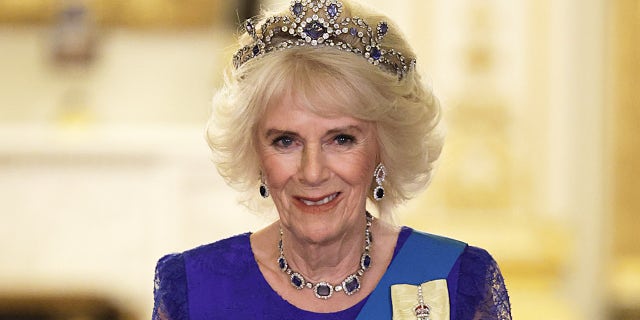 Queen Consort Camilla wears Queen Elizabeth’s sapphire tiara at the state banquet.