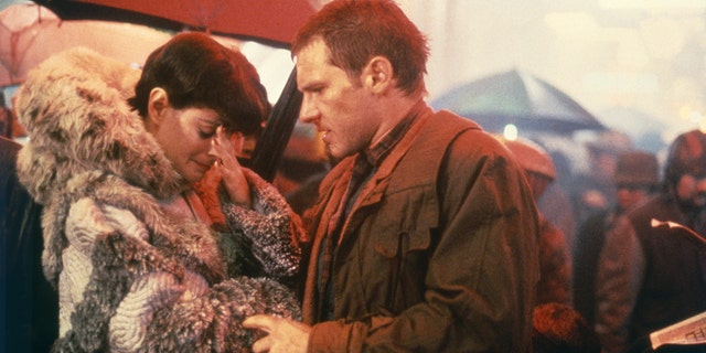 Sean Young and Harrison Ford on the set of "Blade Runner," directed by Ridley Scott.