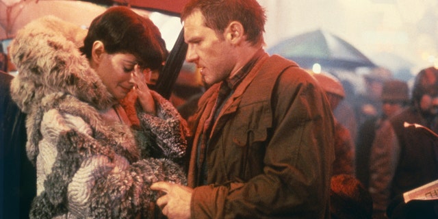 Sean Young and Harrison Ford on the set of "Blade Runner," directed by Ridley Scott.