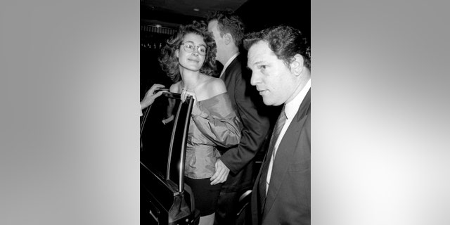 Sean Young, left, and Harvey Weinstein are seen at a film premiere at the Ziegfeld Theater in New York City on August 1, 1989.  Young said "Nice to see Harvey Weinstein go down" Amidst the #MeToo movement.