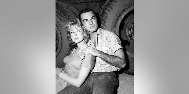 Venetia Stevenson next to a young Burt Reynolds, circa 1960.