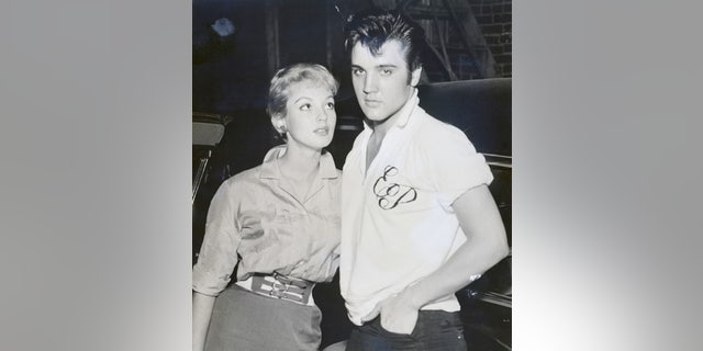 Venetia Stevenson poses with Elvis Presley at his home in Memphis.