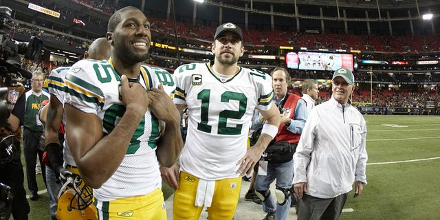 Green Bay Packers QB Aaron Rodgers (12) and Greg Jennings (85) on the sideline during a game against the Atlanta Falcons at the Georgia Dome in Atlanta Jan. 15, 2011.   