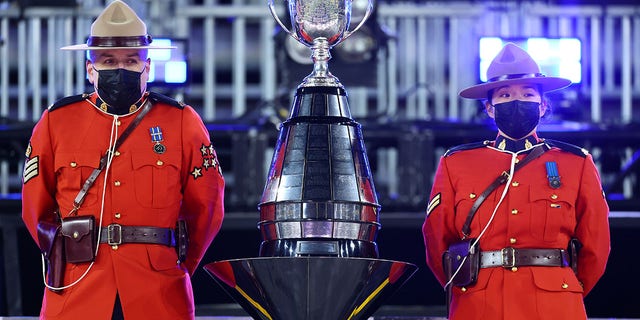  Canadian Mounties guard the Grey Cup following the 108th Grey Cup CFL Championship Game between the Winnipeg Blue Bombers and the Hamilton Tiger-Cats at Tim Hortons Field on Dec. 12, 2021 in Hamilton, Ontario, Canada.