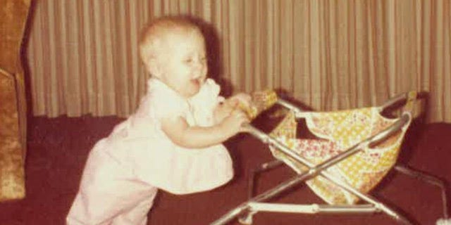 Ten-month-old Holly Marie Clouse is pictured here pushing a walker in late 1980.