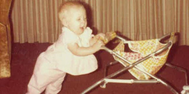 Ten-month-old Holly Marie Clouse is pictured here pushing a walker in late 1980.