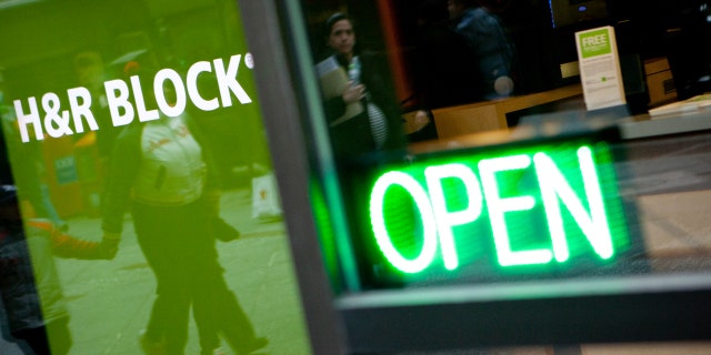 The H&R Block Inc. logo is displayed in front of the company's flagship office in New York, U.S., on Friday, March 2, 2012. 