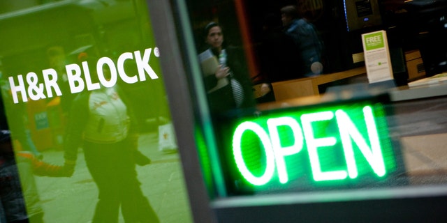 The H&R Block Inc. logo is displayed in front of the company's flagship office in New York, U.S., on Friday, March 2, 2012. 