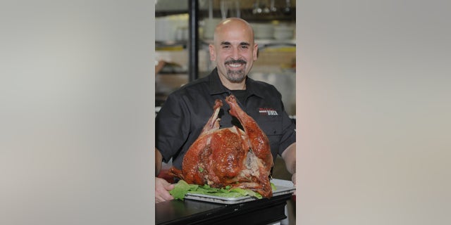 Mike's City Diner chef-owner Jay Hajj with brined turkey. Mike's City Diner serves turkey every day in many different ways. 