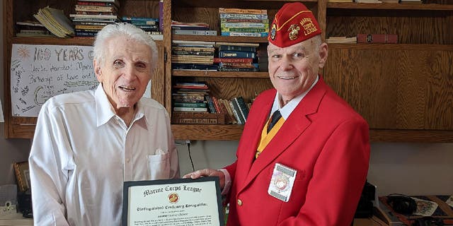 World War II veteran Harold Chilton (left) received a "Distinguished Centenary Recognition" award from the Marine Corps League on his 100th birthday. David Niemann (right) of the Northwest Arkansas Detachment 854 presented the award to him on Nov. 12, 2022.