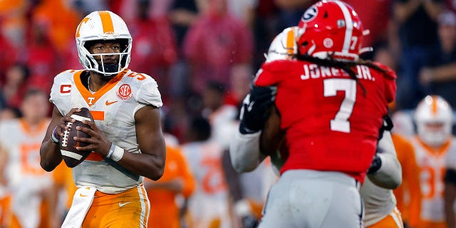 Hendon Hooker (5) of the Tennessee Volunteers looks to pass the Georgia Bulldogs during the fourth quarter at Sanford Stadium on November 5, 2022, in Athens, Georgia.